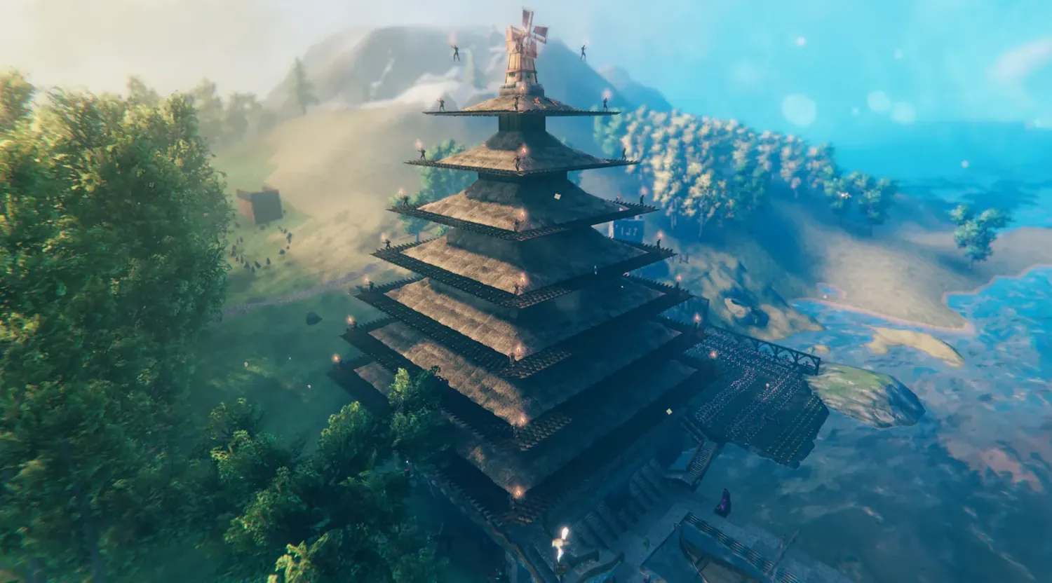 An automated aerial photograph of a many-tiered Valheim building rising above the trees